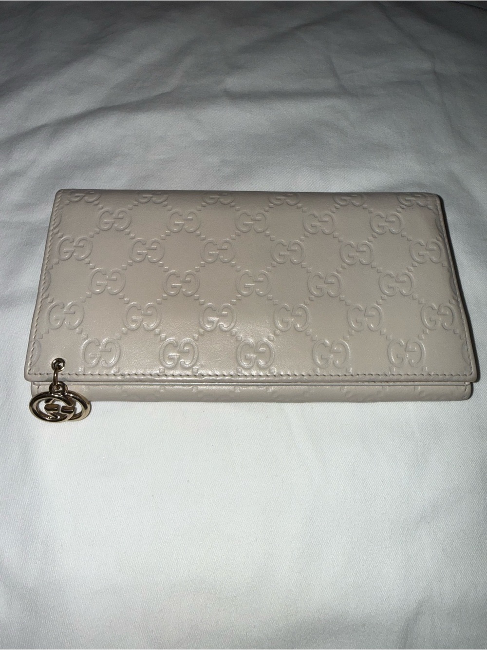 Gucci Guccissima off-white Embossed GG Continental Wallet with Gold Charm